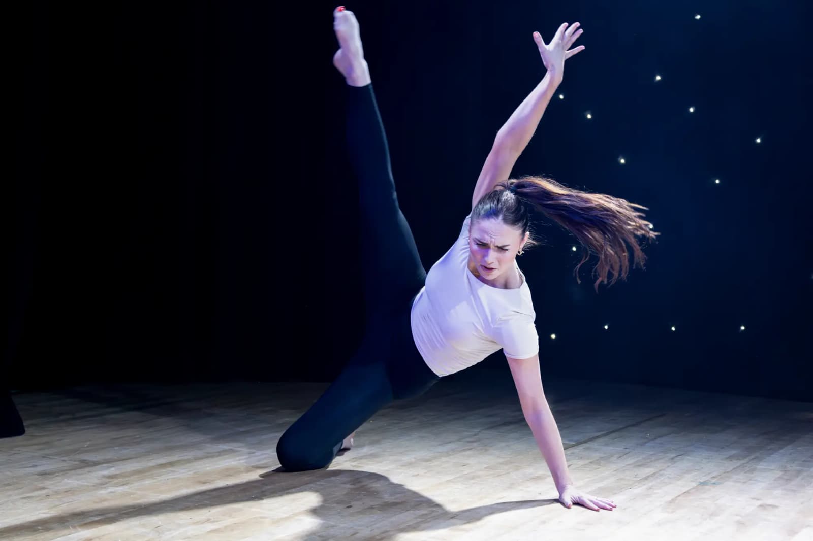 Sophie in a dramatic floor-based contemporary pose