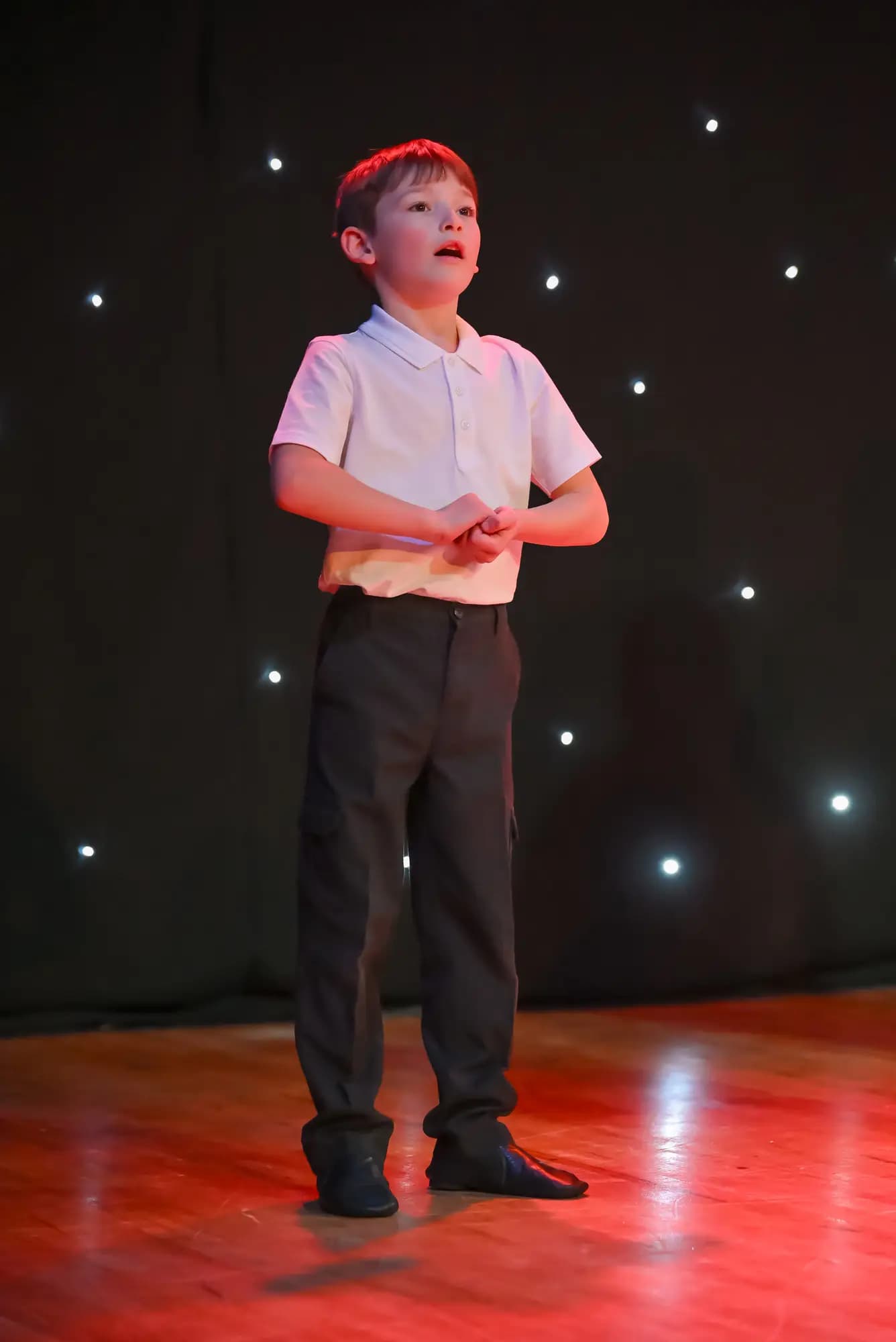 Young soloist performing on stage