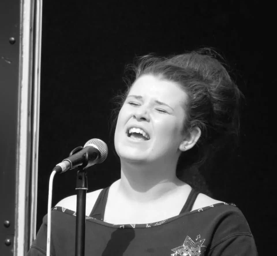 Vocalist mid-song at the microphone