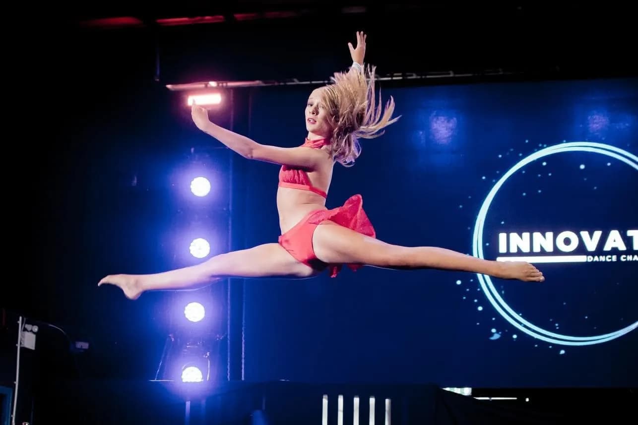 Star-Struck contemporary dancer mid-leap during a Solihull performance