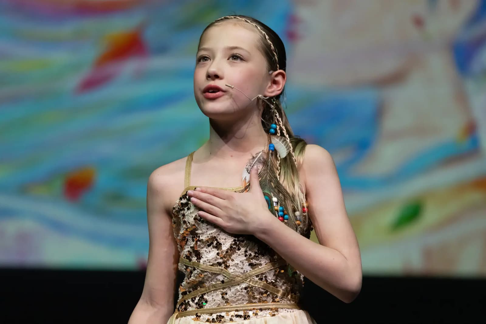 Star-Struck student performing a vocal solo on stage